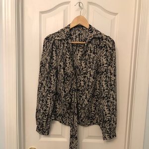 Long sleeve very soft material with tie in front. Size 6